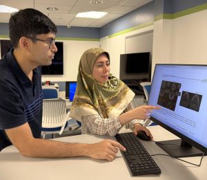 Dr. Mina Mahdian and Dr. Prateek Prasanna in consult with each other